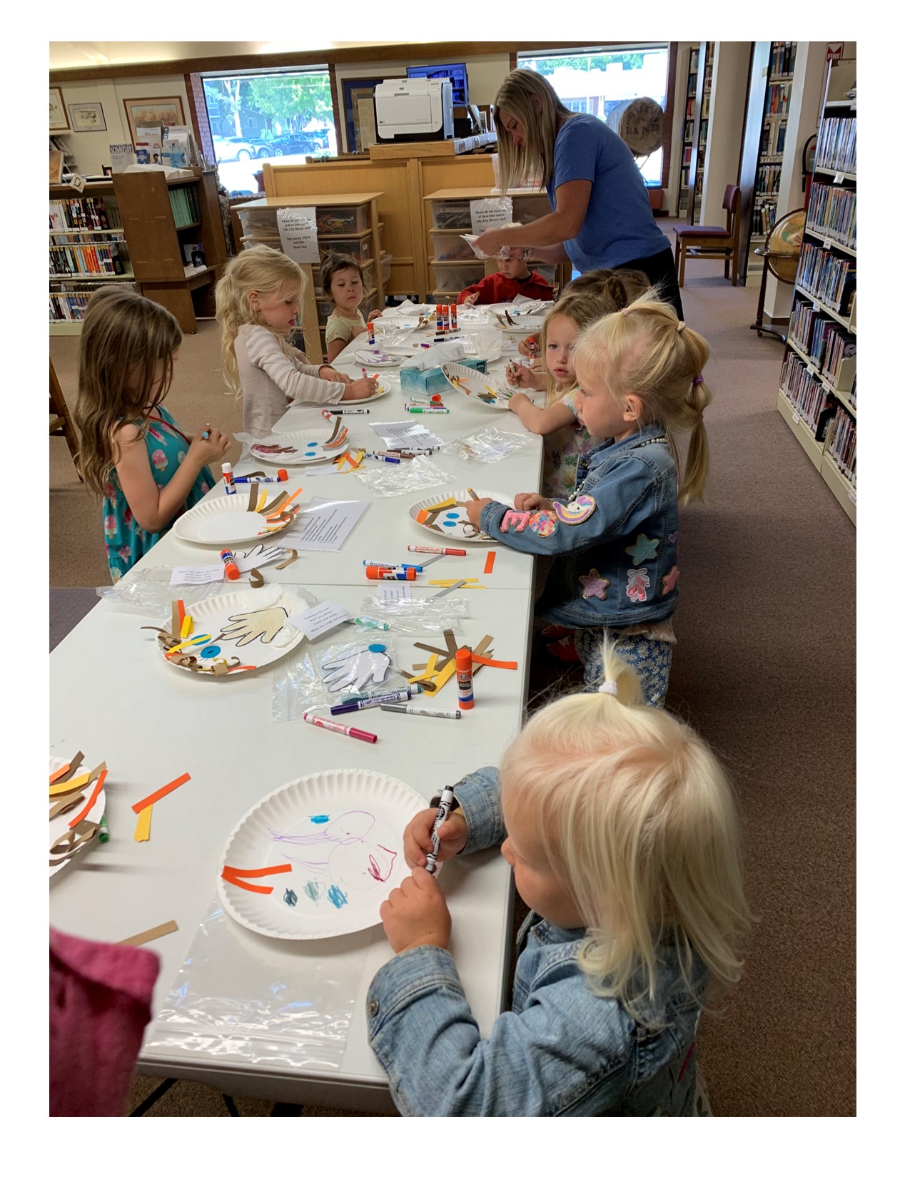 pic of kids making craft, Germs 2024 story time.jpg