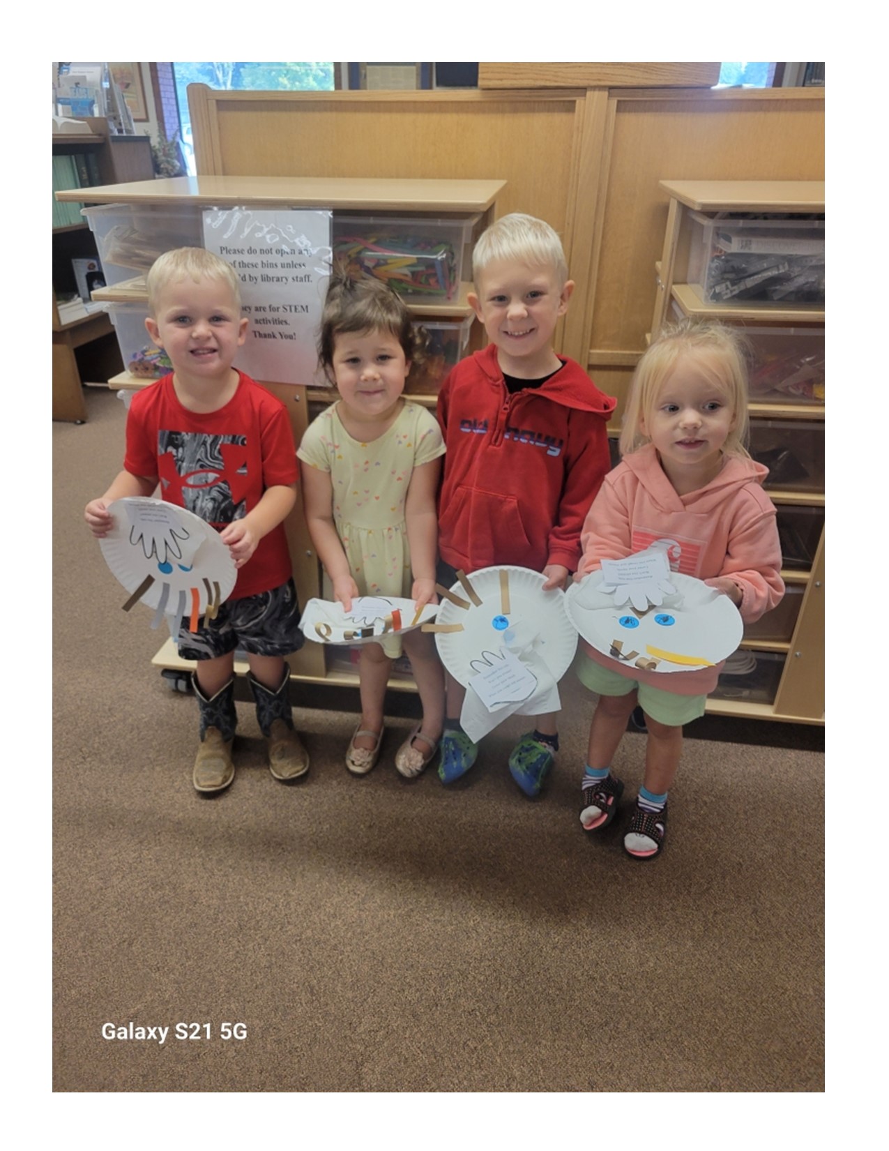 Jen Dougall pic of kids making craft, Germs 2024 story time.jpg
